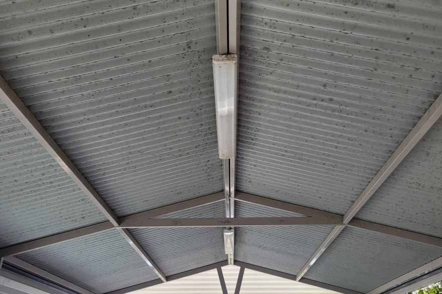 Soft washing a patio roof: before