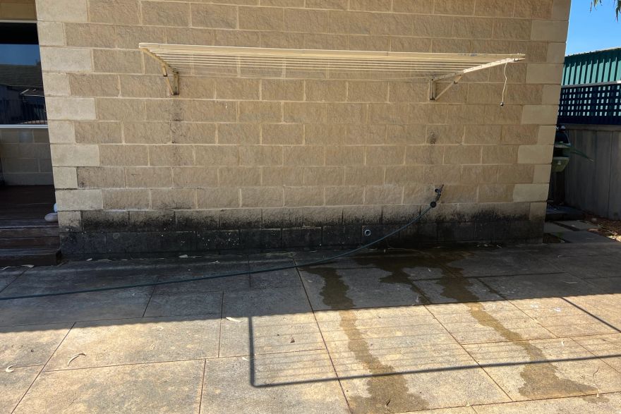 Beside a wall: before