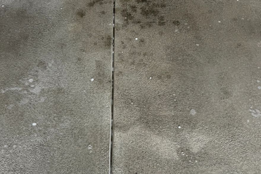 Before and after oil stains on concrete slab · Garage floor: after
