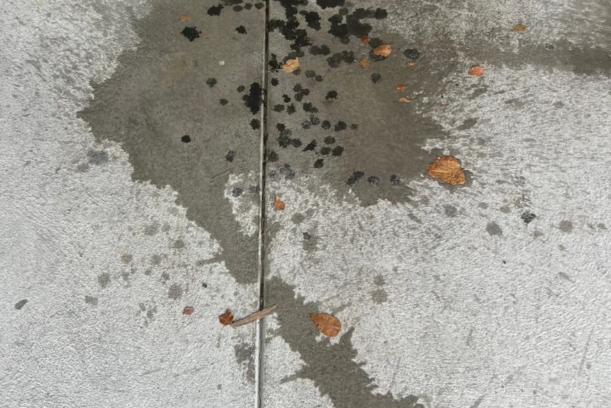 Before and after oil stains on concrete slab · Garage floor: before
