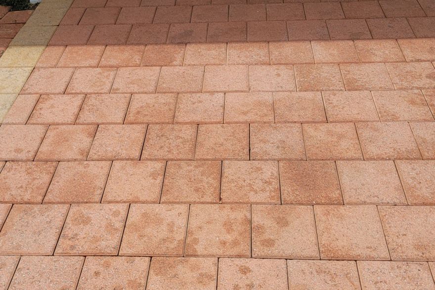 Before and after oil stains on brick pavers · Driveway: after