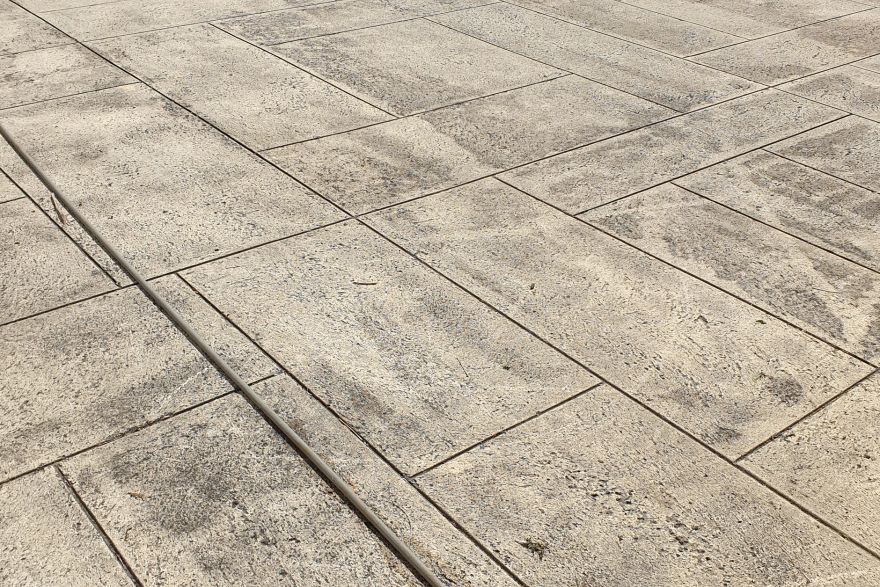 Before and after cleaning on liquid limestone · Driveway: before
