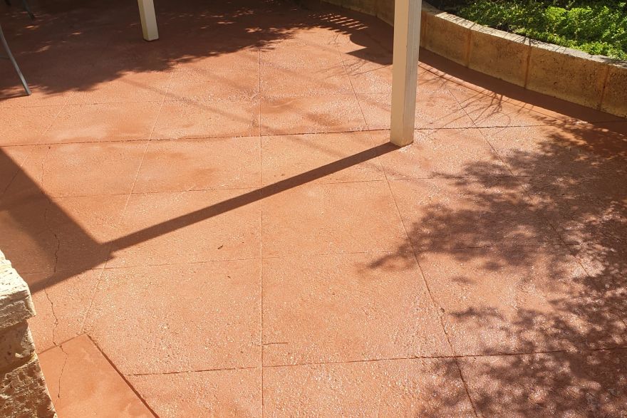 Before and after cleaning on concrete slab · Patio / alfresco: after