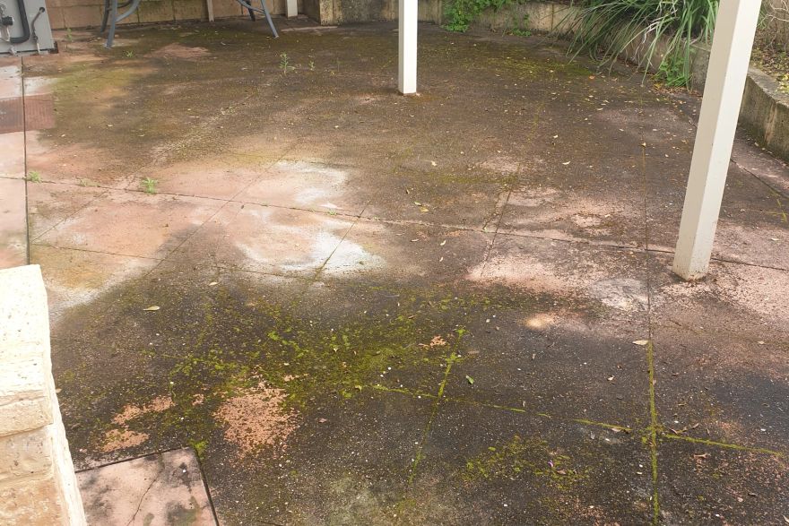 Before and after cleaning on concrete slab · Patio / alfresco: before