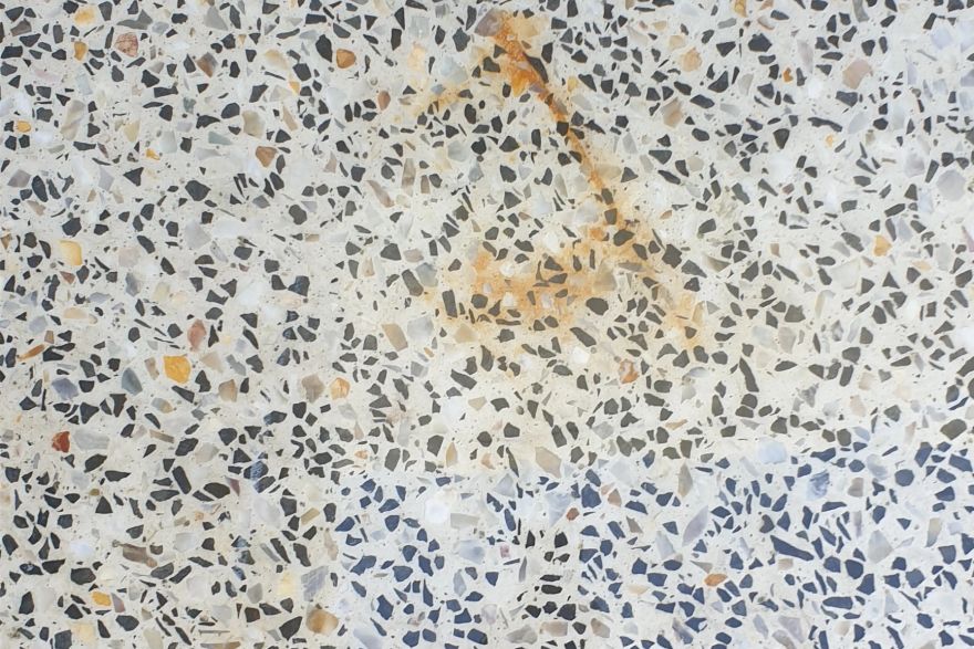 Before and after rust / bore stains on concrete exposed aggregate: before