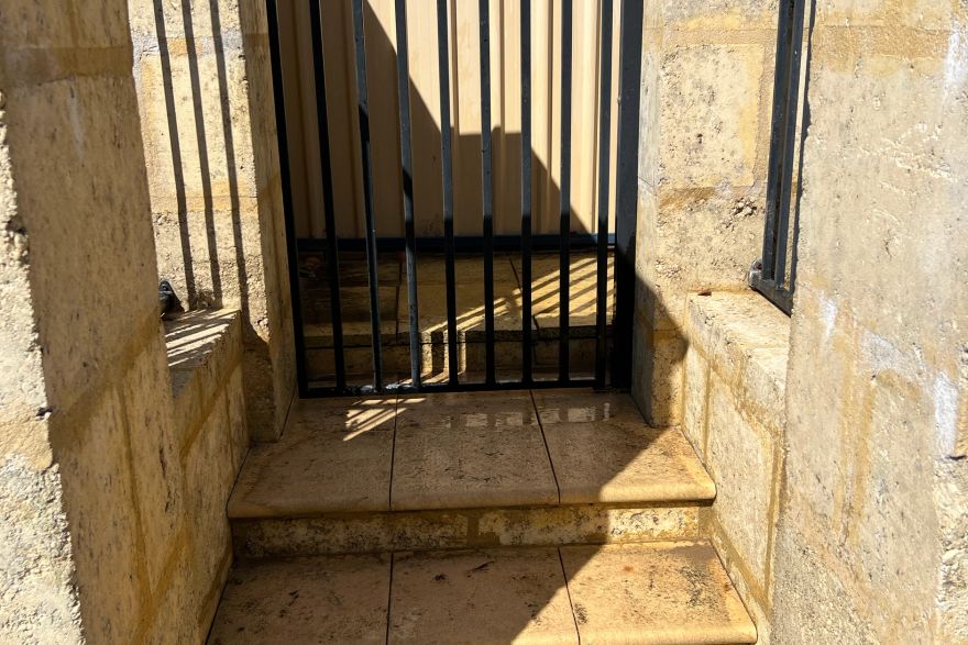 Before and after cleaning on sandstone pavers: after