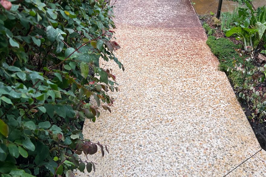 Before and after rust / bore stains on concrete exposed aggregate: before