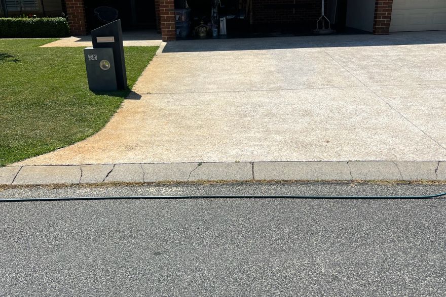 Before and after rust / bore stains on concrete exposed aggregate · Driveway: before