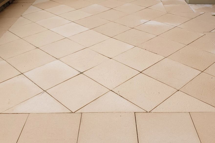 Before and after cleaning on sandstone pavers: after