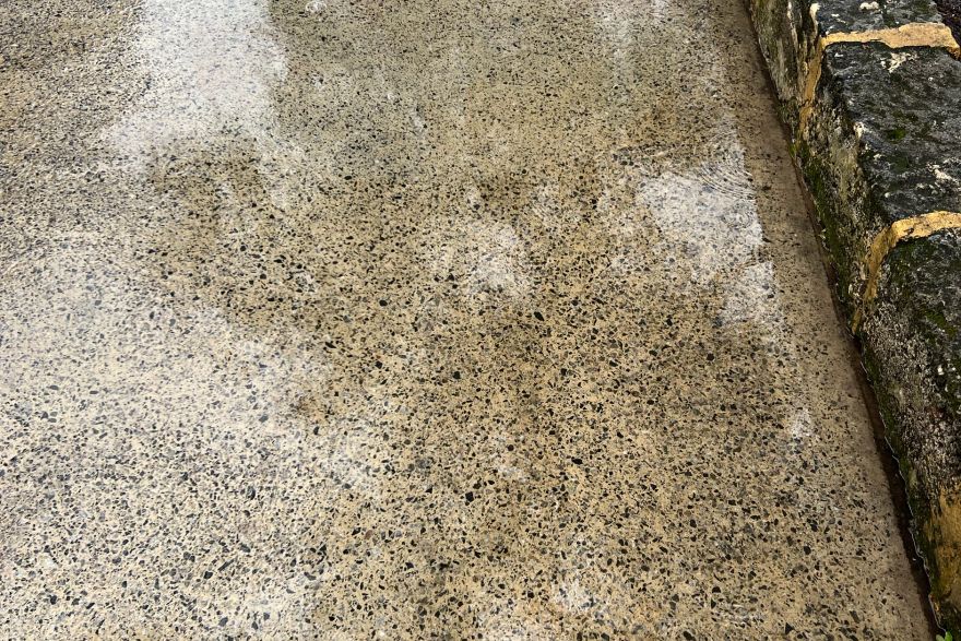 Before and after paint removal on concrete slab: after