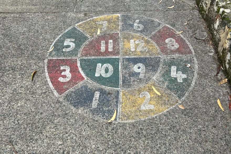 Before and after paint removal on concrete slab: before