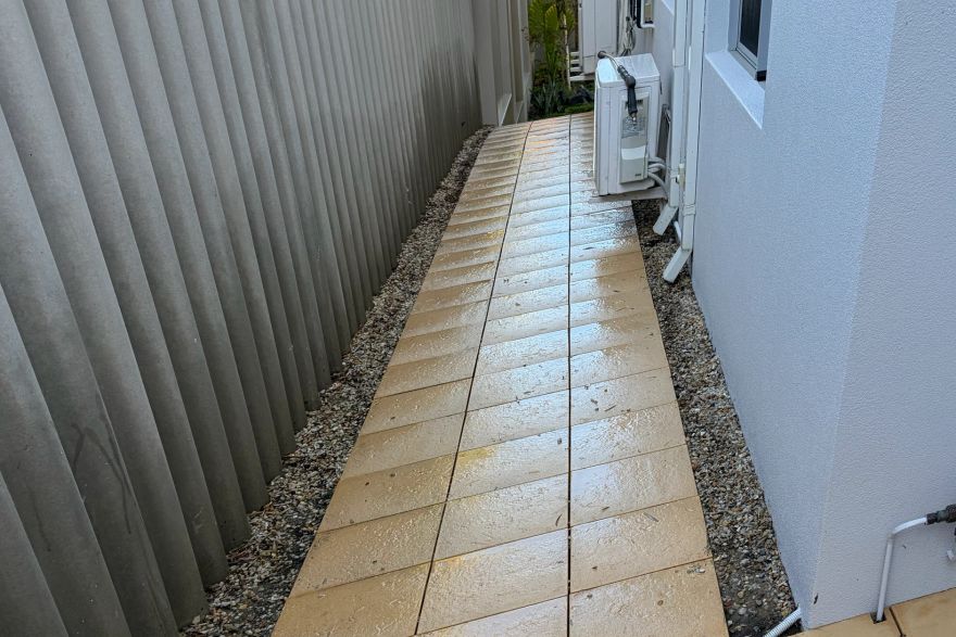 Before and after cleaning on sandstone pavers · Path: after