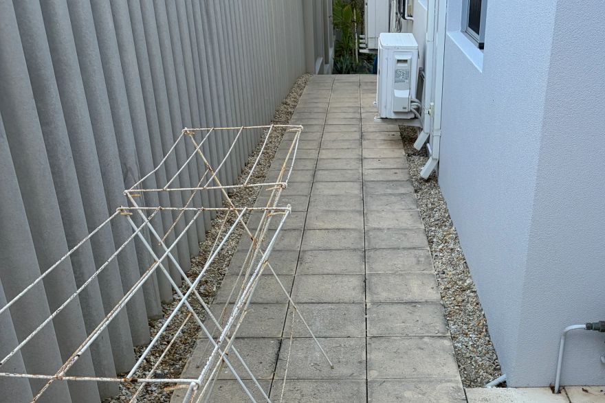 Before and after cleaning on sandstone pavers · Path: before