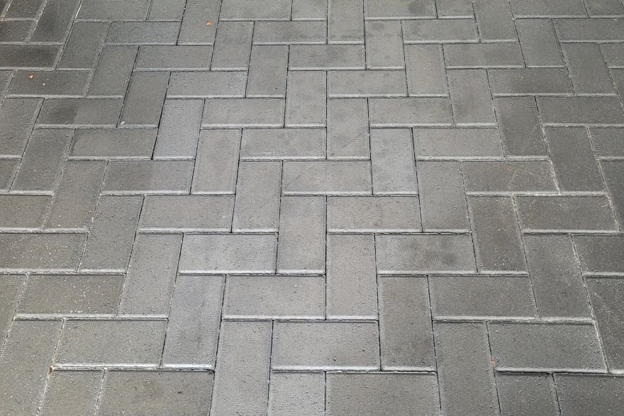 Before and after oil stains on brick pavers · Garage floor: after
