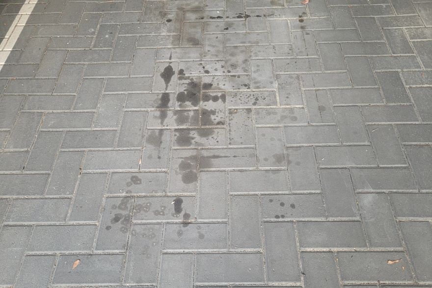Before and after oil stains on brick pavers · Garage floor: before
