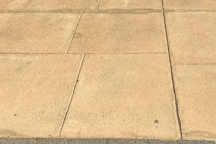 Before and after cleaning on liquid limestone · Driveway: after