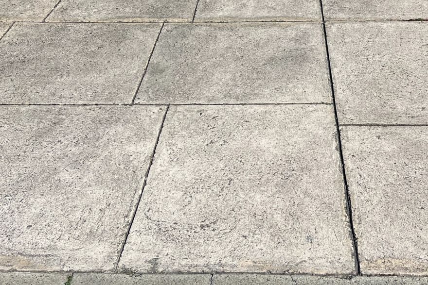 Before and after cleaning on liquid limestone · Driveway: before