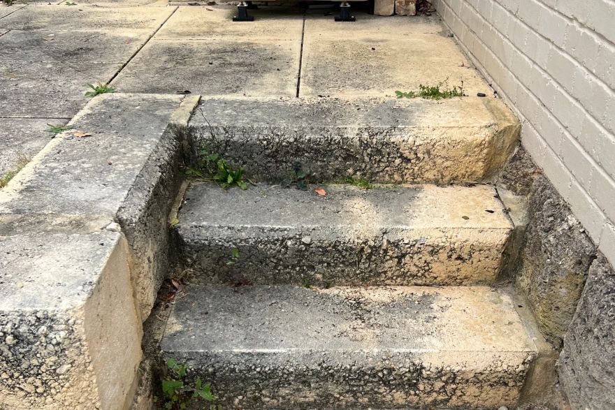 Before and after cleaning on limestone block: before