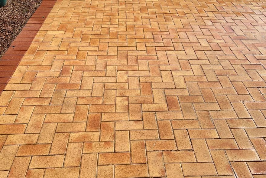 Before and after cleaning on brick pavers · Poolside: after