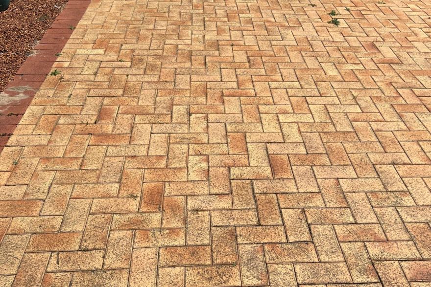 Before and after cleaning on brick pavers · Poolside: before