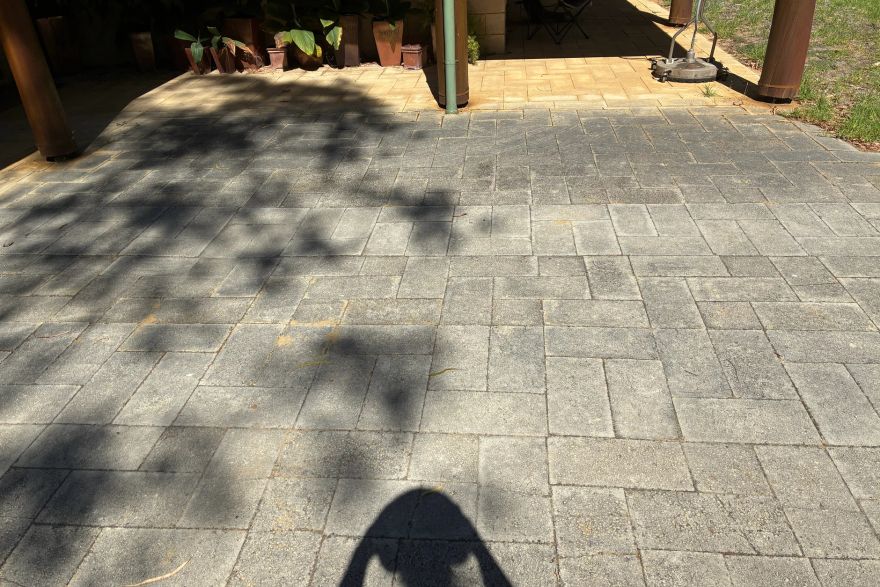 Before and after cleaning on brick pavers: before