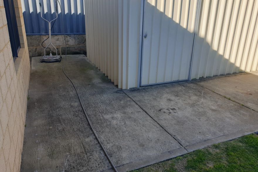 Before and after cleaning on concrete slab: before