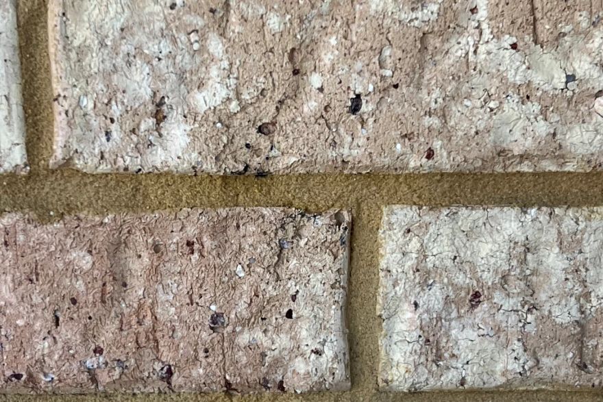 Before and after graffiti on house bricks: after