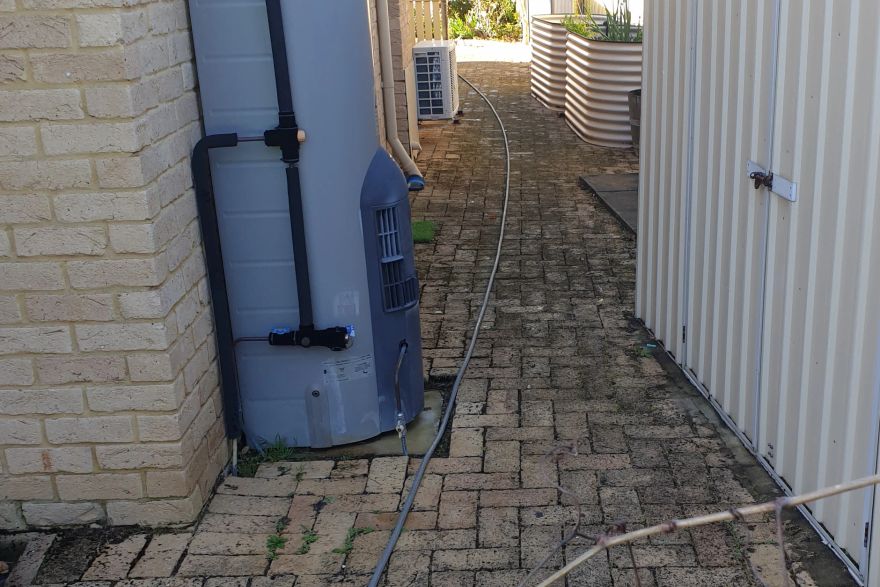 Before and after cleaning on brick pavers: before