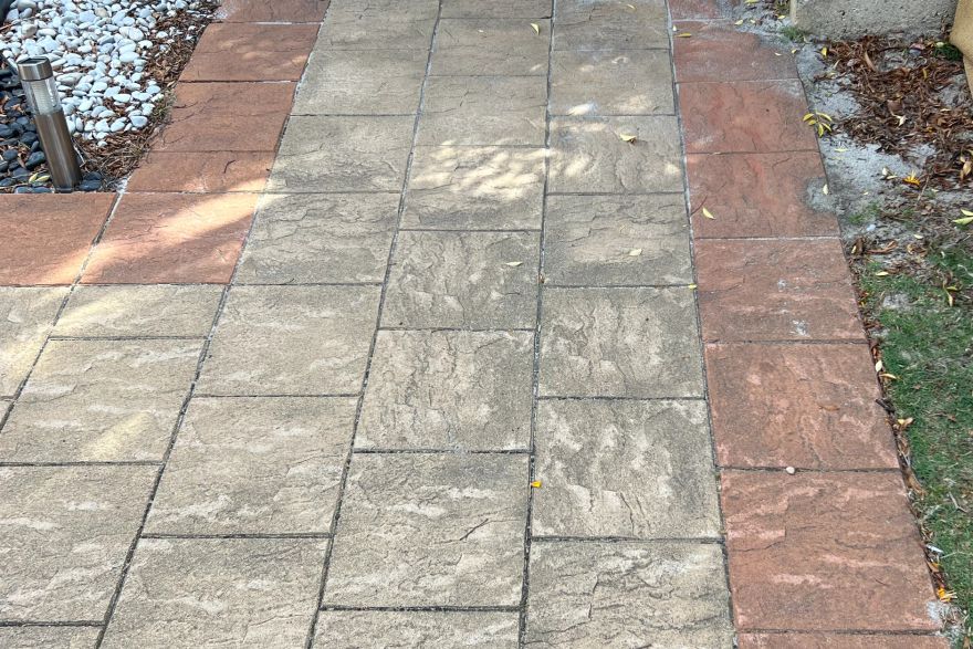 Before and after cleaning on brick pavers: before