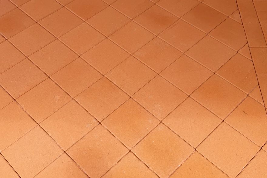 Before and after paint removal on brick pavers · Patio / alfresco: after