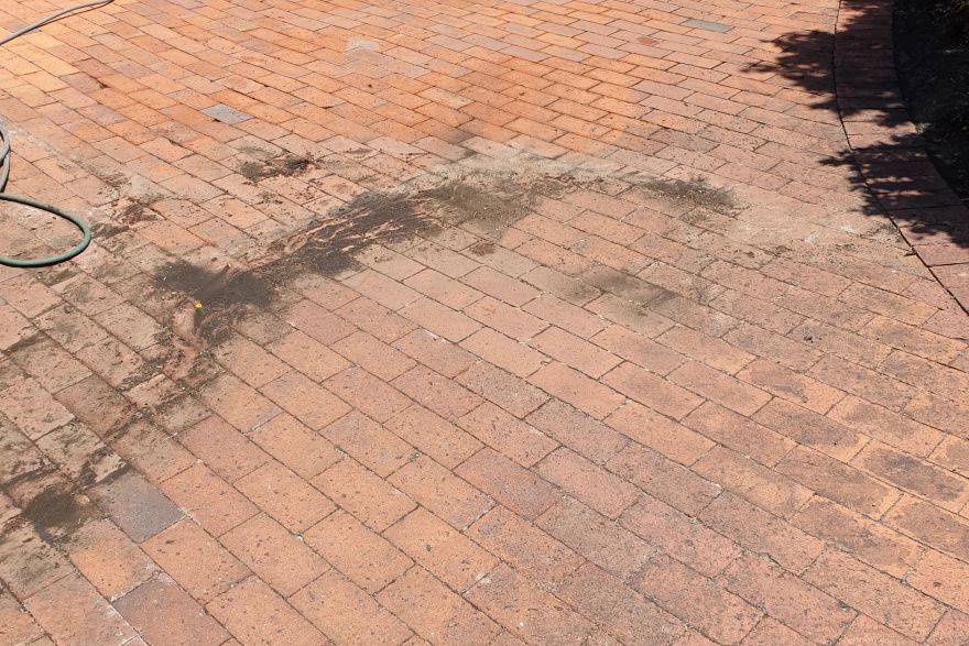 Before and after cleaning on brick pavers: before