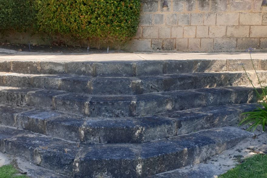 Before and after cleaning on limestone block: before