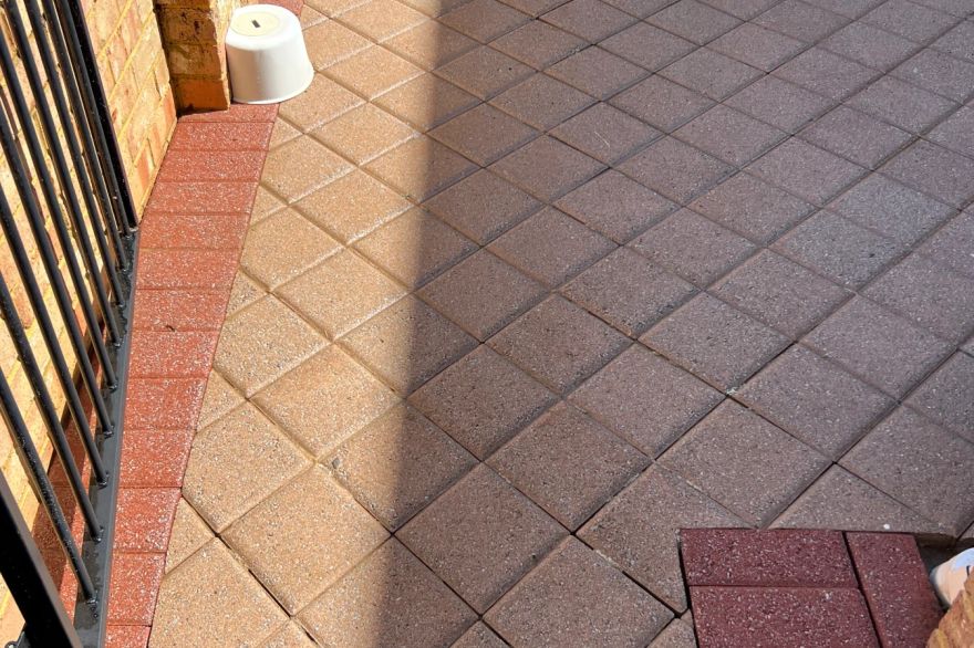 Before and after cleaning on brick pavers: after