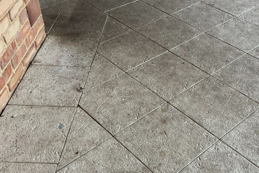 Before and after cleaning on sandstone pavers: before