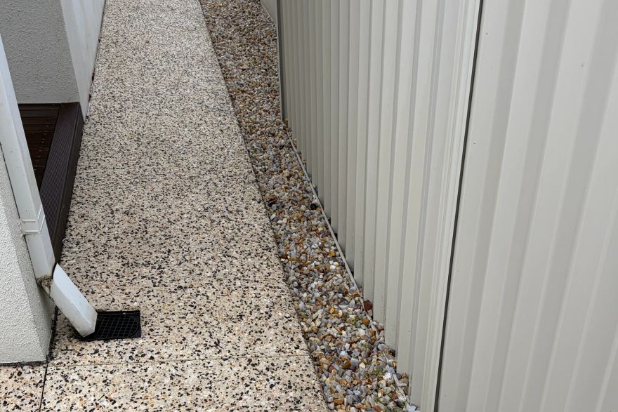 Before and after cleaning on concrete exposed aggregate: after