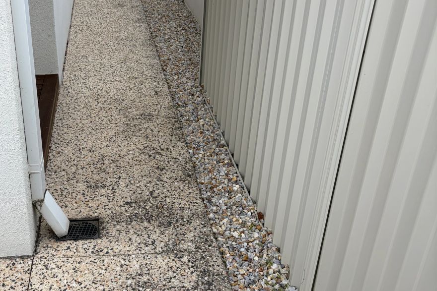 Before and after cleaning on concrete exposed aggregate: before