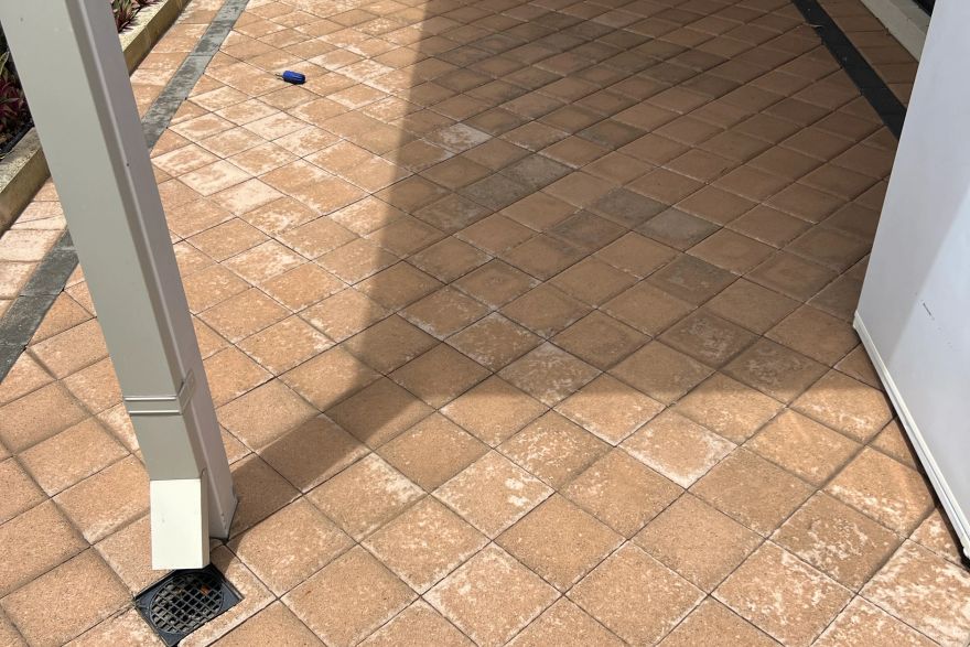 Before and after cleaning on brick pavers · Patio / alfresco: after