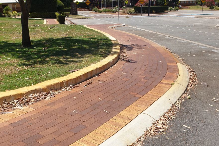 Before and after rust / bore stains on brick pavers: before