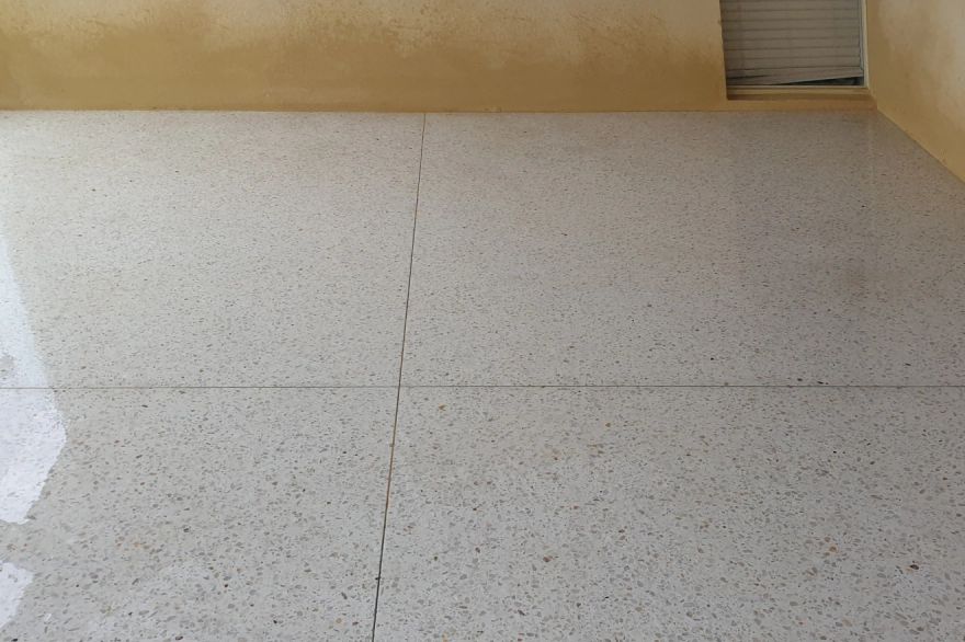 Before and after cleaning on concrete exposed aggregate · Garage floor: after