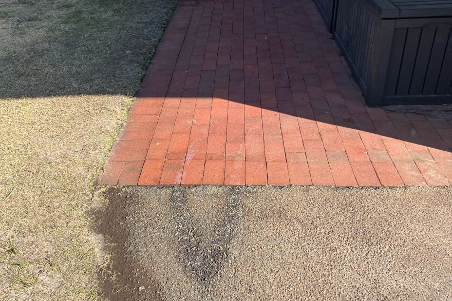 Before and after paint removal on brick pavers: after