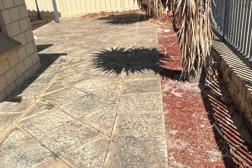 Before and after cleaning on sandstone pavers: before