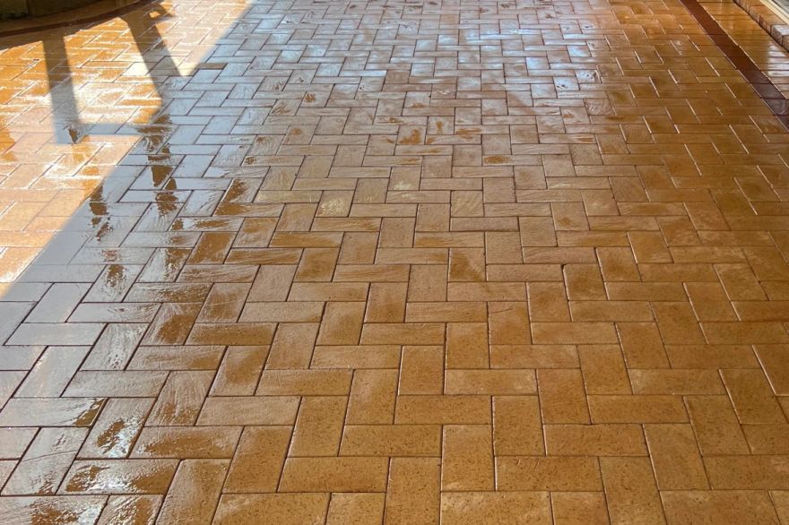 Before and after cleaning on brick pavers · Patio / alfresco: after