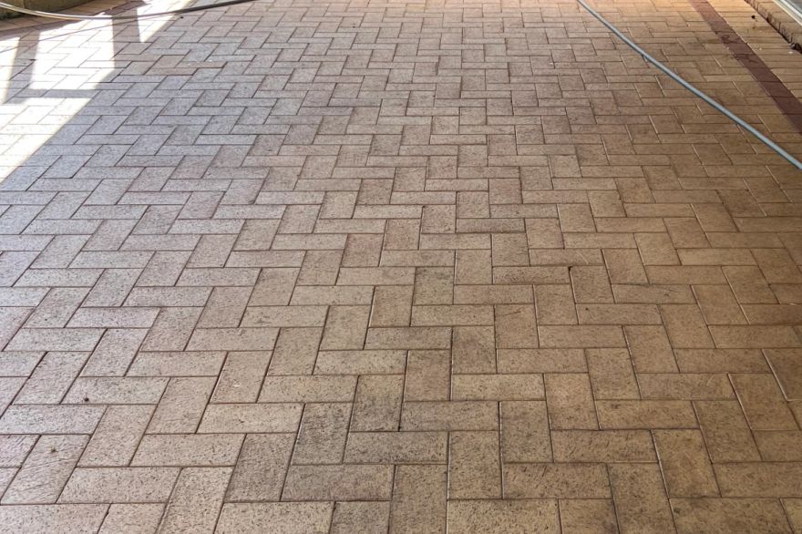 Before and after cleaning on brick pavers · Patio / alfresco: before