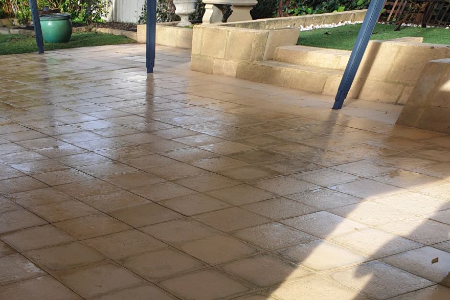 Before and after cleaning on sandstone pavers, limestone block · Patio / alfresco: after