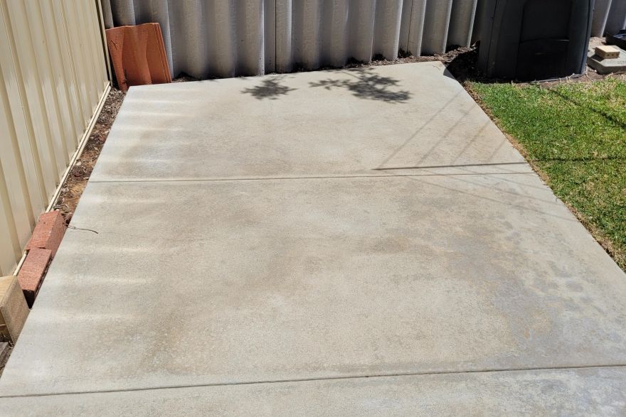 Before and after cleaning on concrete slab · Path: after