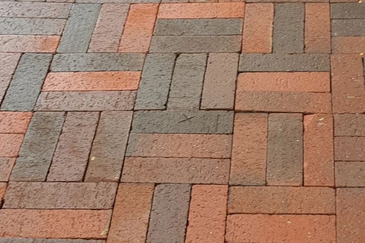 Before and after cleaning on brick pavers: after