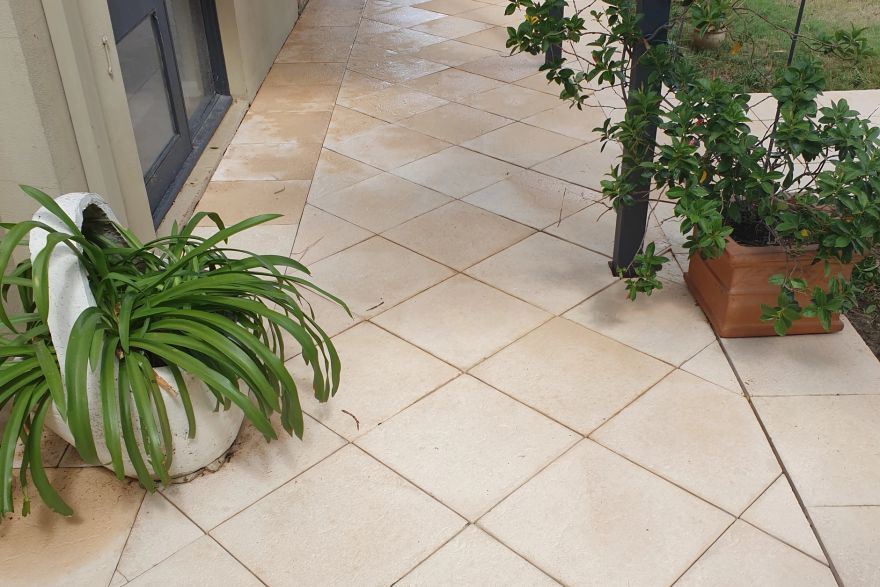 Before and after cleaning on sandstone pavers: after