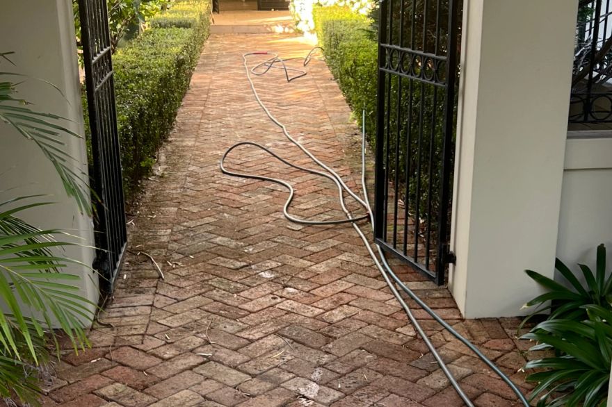 Before and after cleaning on brick pavers: before