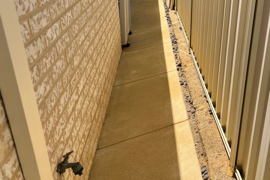 Before and after cleaning on concrete slab · Path: after