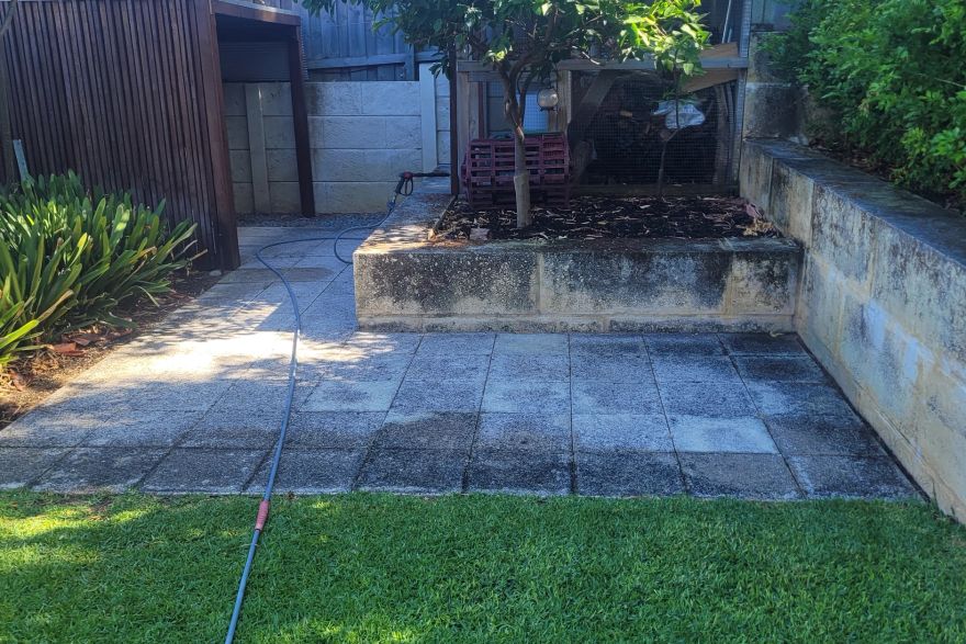 Before and after cleaning on sandstone pavers: before